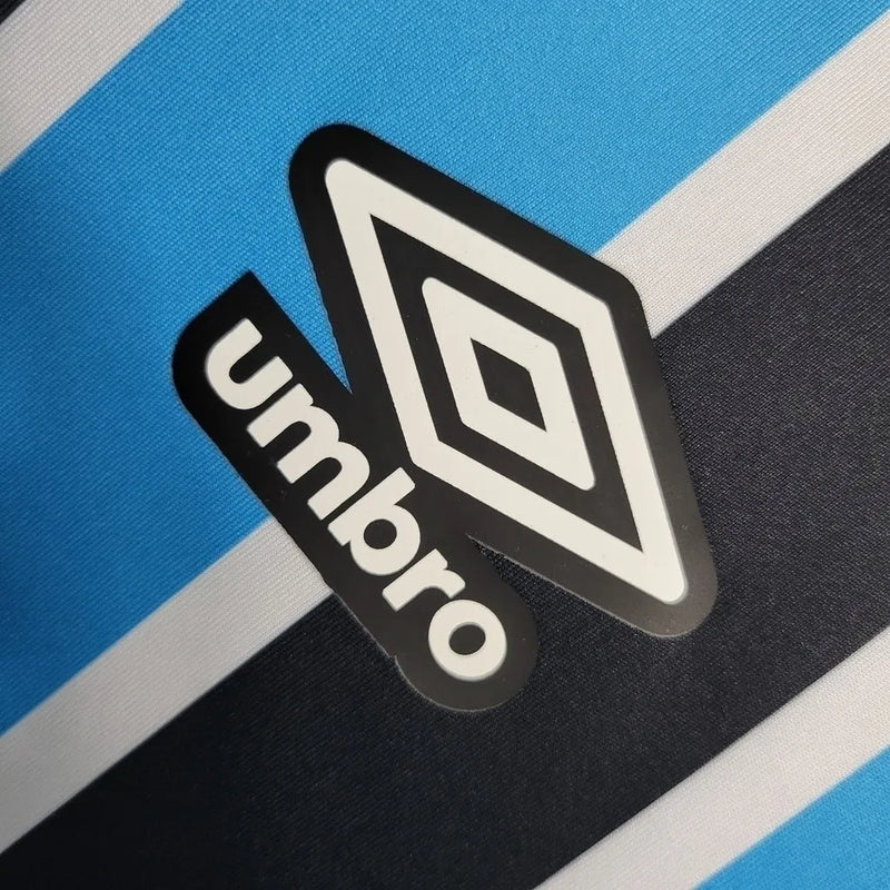 Camisa Grêmio I 23/24 - Torcedor Umbro Feminina - Azul com listras pretas e brancas