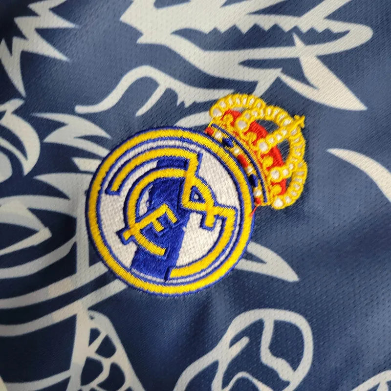 Camisa Real Madrid Edição Especial 23/24 - Torcedor Adidas Masculina - Azul com detalhes em branco e amarelo