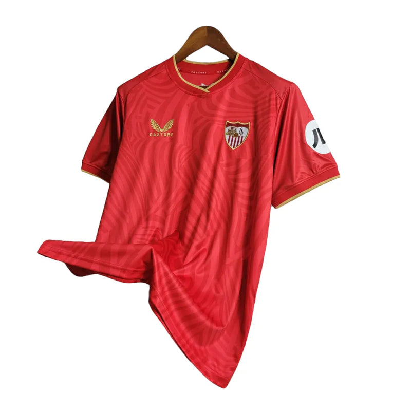 Camisa Sevilla II 23/24 - Torcedor Castore Masculina - Vermelha com ondulações cinza e dourado