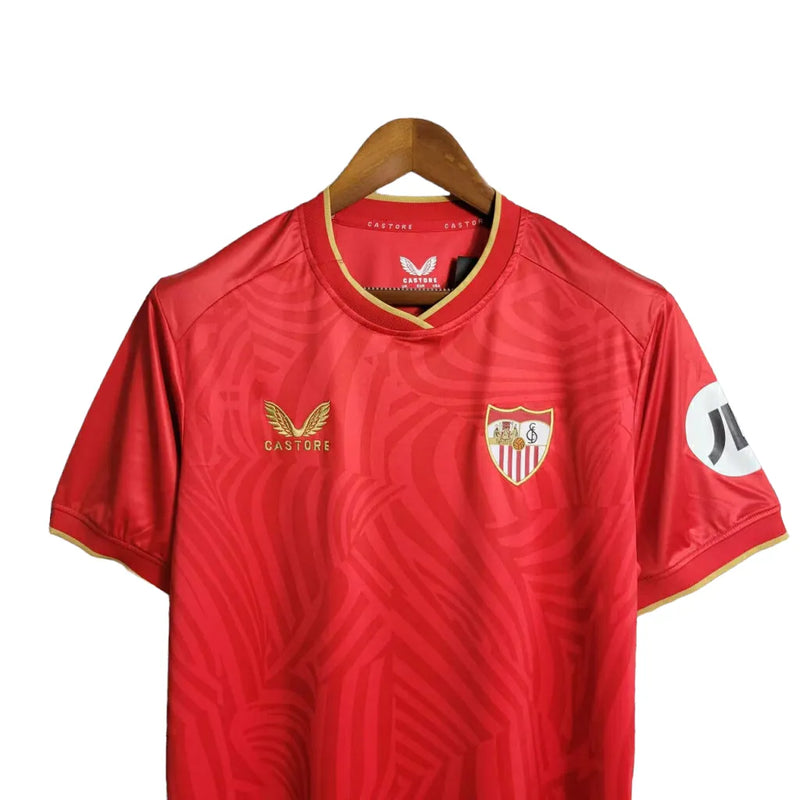 Camisa Sevilla II 23/24 - Torcedor Castore Masculina - Vermelha com ondulações cinza e dourado