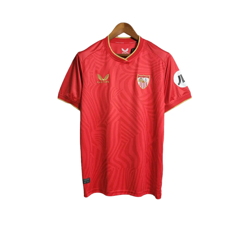 Camisa Sevilla II 23/24 - Torcedor Castore Masculina - Vermelha com ondulações cinza e dourado