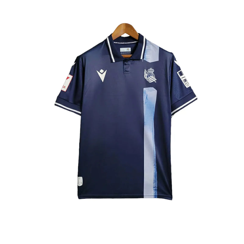 Camisa Real Sociedad II 23/24 - Torcedor Macron Masculina - Azul com faixa em branco na lateral