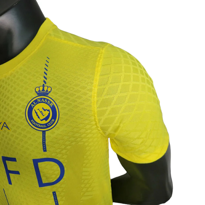 Camisa Al-Nassr I 23/24 - Jogador Nike Masculina - Amarela com detalhes em azul