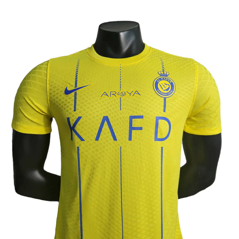 Camisa Al-Nassr I 23/24 - Jogador Nike Masculina - Amarela com detalhes em azul