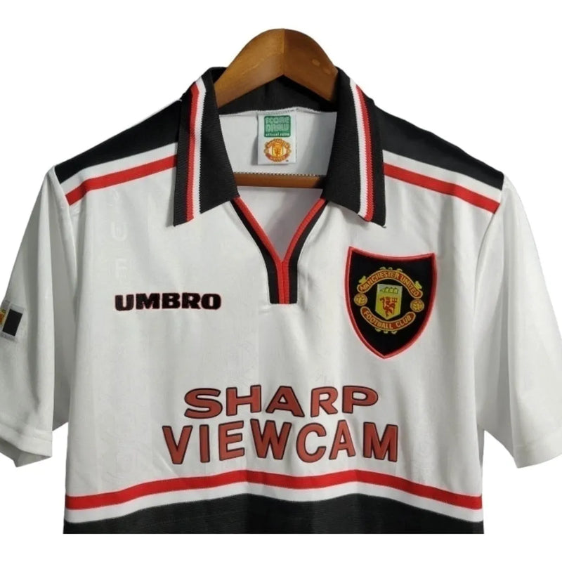 Camisa Retrô Manchester United 98/99 - Masculina Umbro - Branca com detalhes em preto e vermelho