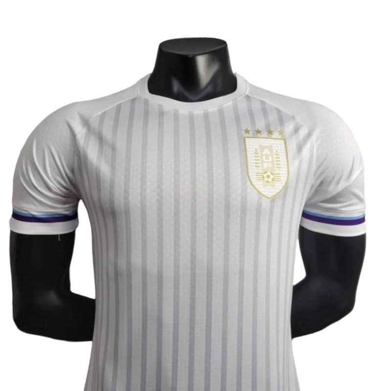 Camisa Seleção do Uruguai I 24/25 - Jogador Masculina - Branca com detalhes em azul e dourado